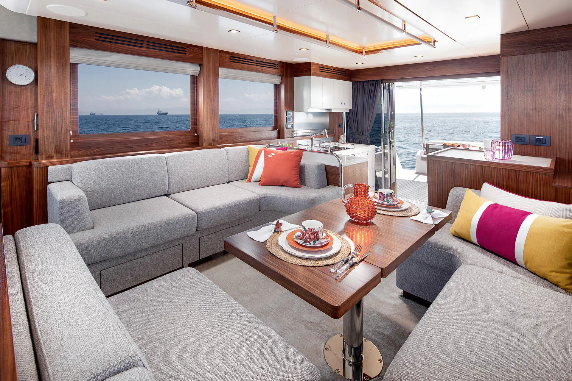 Main saloon with sofas and dining table